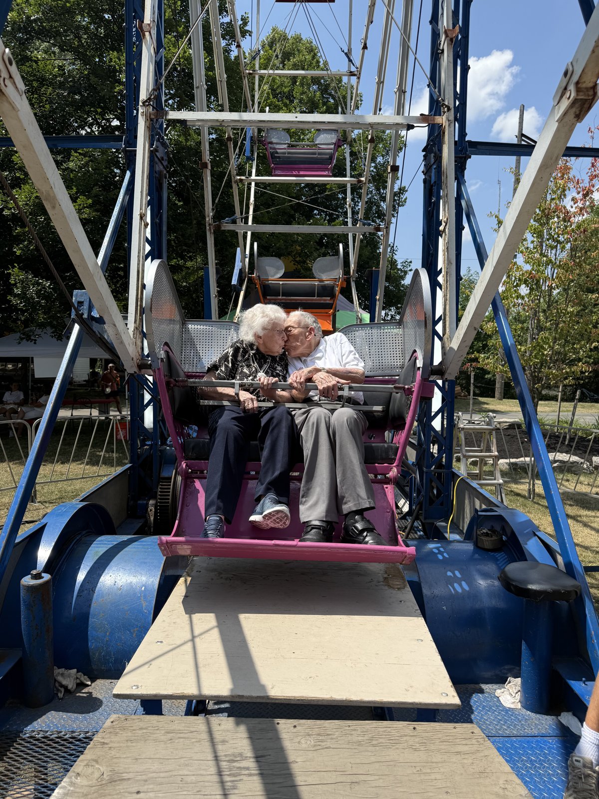 A couple riding the Ferris wheel at Old Home Days