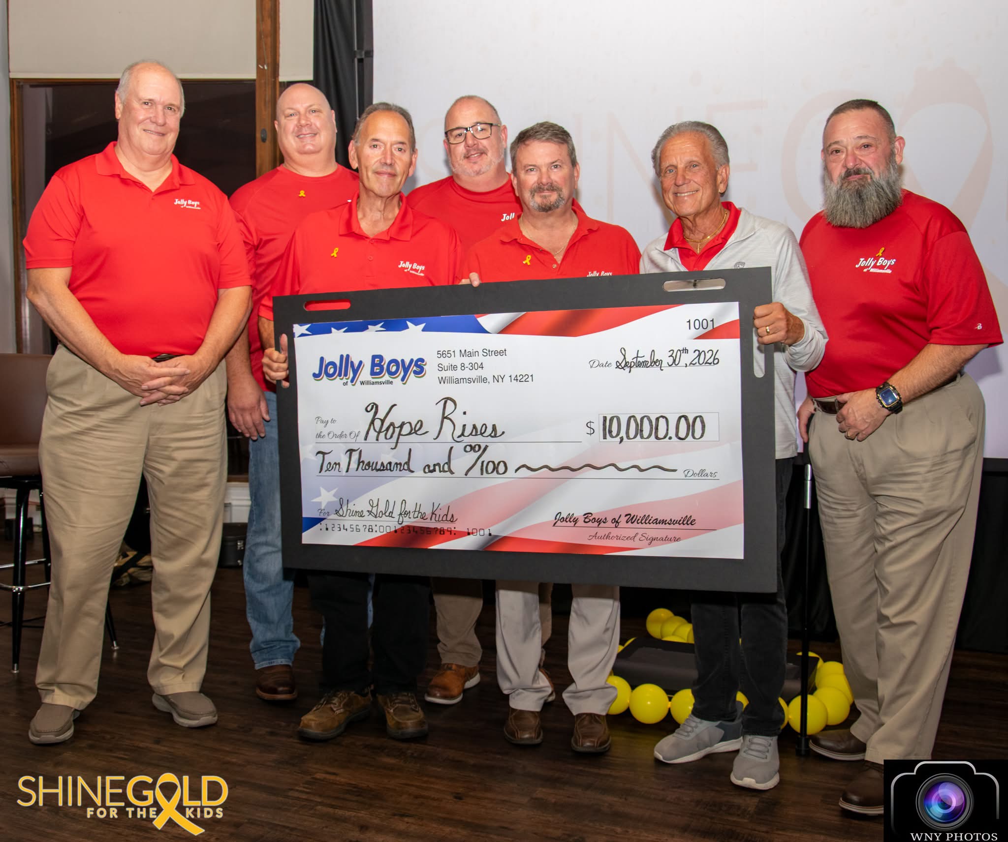 Jolly Boys members presenting a $10,000 check to Hope Rises
